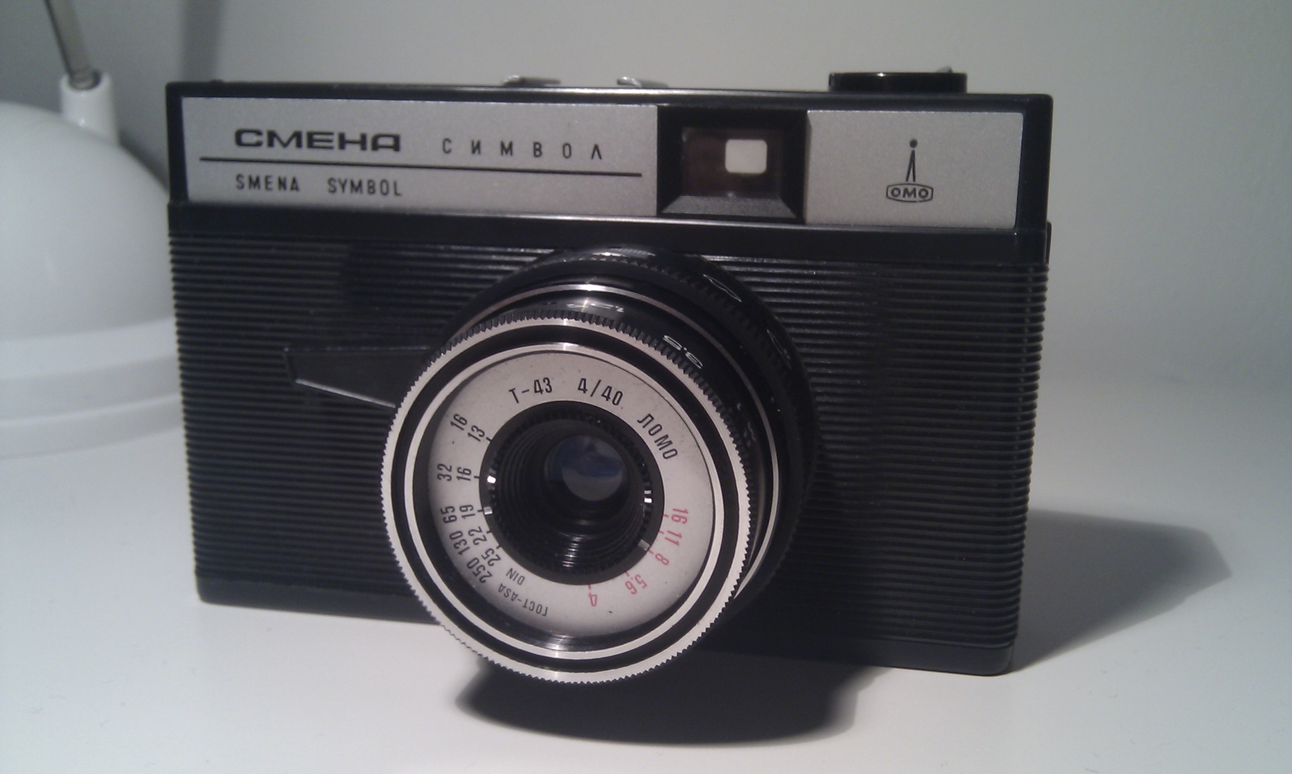 
          I just love going on a flea market and buying any camera that the owner is willing to give away for under 5 EURO. Just like this wonderful Smena Symbol. A plastic camera from Russia, made in the LOMO 
        